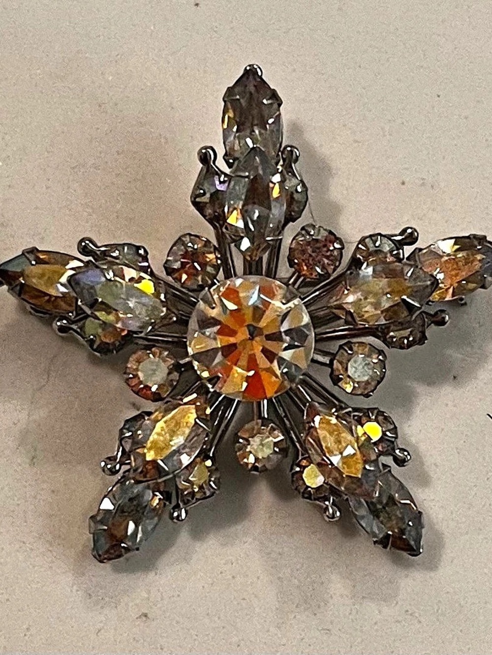 Rhinestone Starburst Brooch in Silver